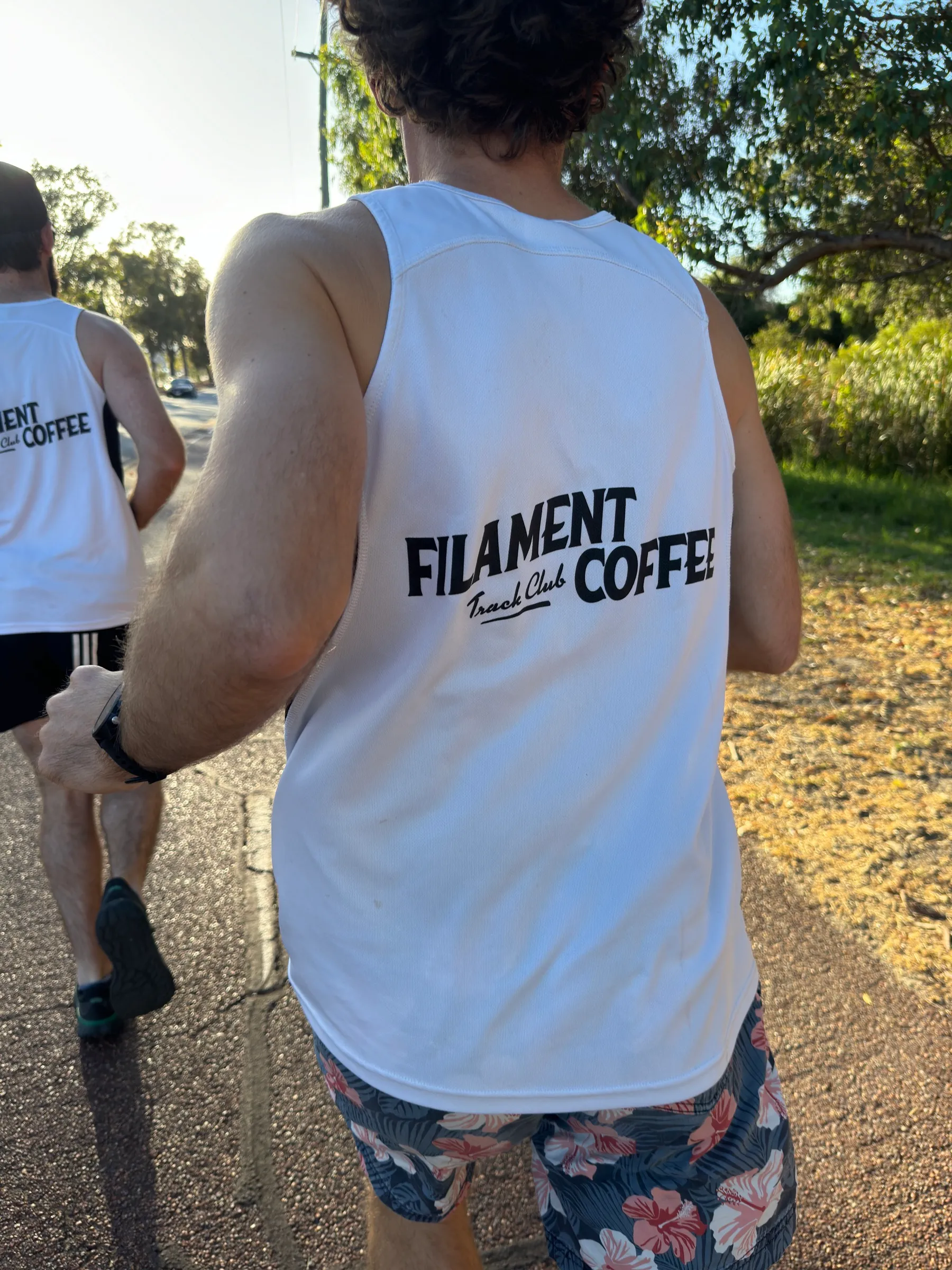 Runner in an FCTC singlet at golden hour
